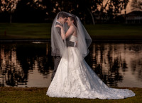 Caitlin & Jake wedding veil over heads at lake