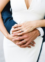 Artistic Hands wrapped with rings around waist