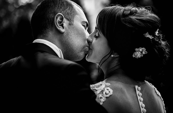 Photojournalistic B & G kissing