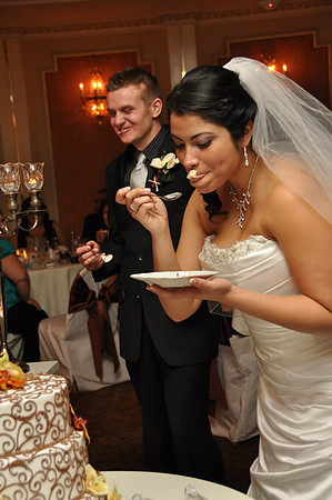 Photojournalistic Bride eating cake