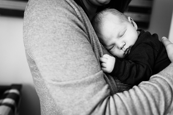 Newborn B & W in arms of mom