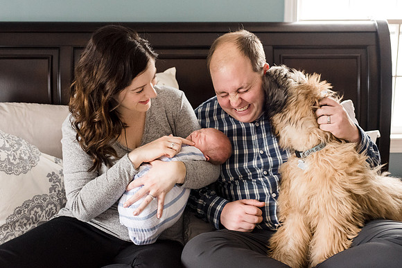 Newborn with couple and dog
