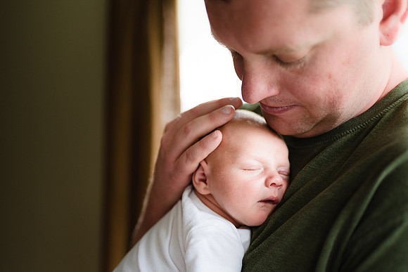 Newborn with dad upclose