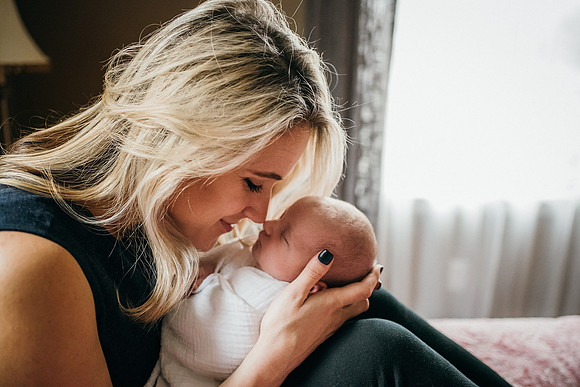 Newborn with mom heart shape