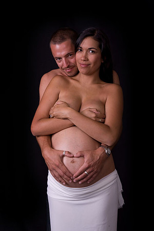 Maternity Mom and Husband covering top