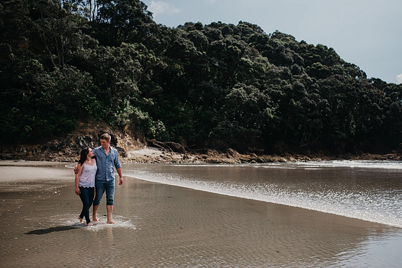 Engagement 22 with couple walking along beach